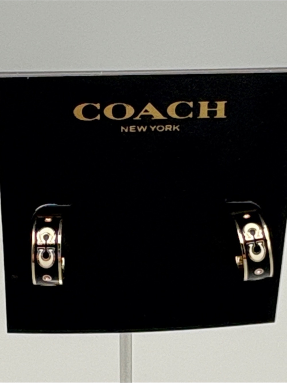 Coach Silver and Black Enamel Logo Huggie Earrings